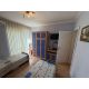 Спальня квартиры 73,62 м² в ЖК Crown Fort Club с двумя кроватями, кондиционером и мебелью.